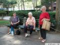 East Village residents take a rest before climbing up 10 flights of stairs carrying weighty bottles of water. (8/15/03)